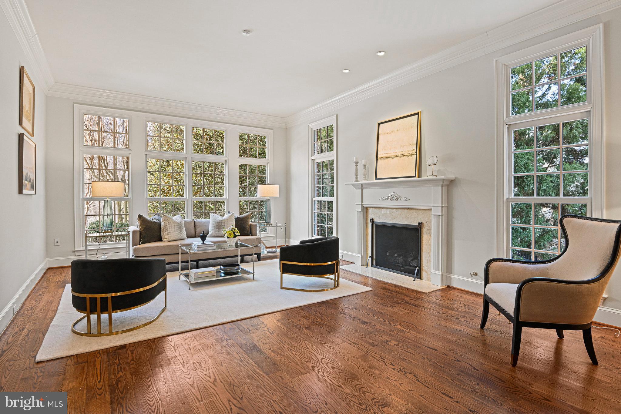 1064 Silent Ridge Court McLean, VA 22102 - Photo 8 of 70 a living room with furniture and a fireplace