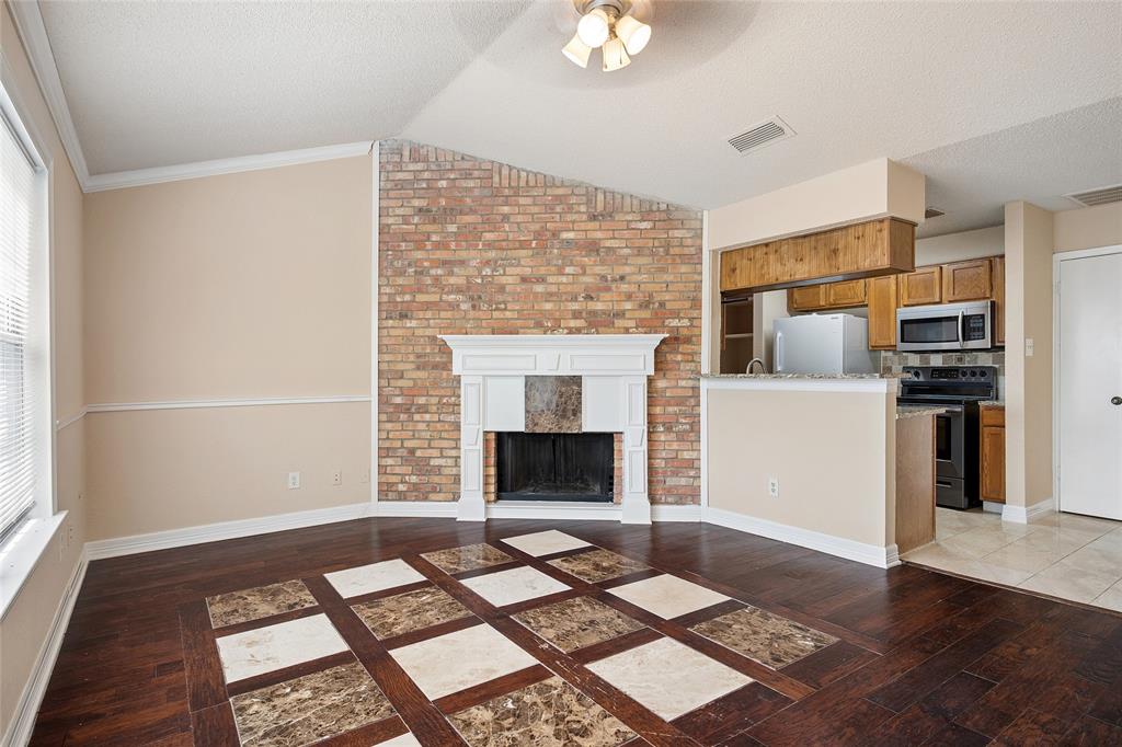 2400 Jupiter Road, Unit B9 Plano, TX 75074 - Photo 2 of 15 Living area is open to the kitchen ideal for including the cook in the party.
