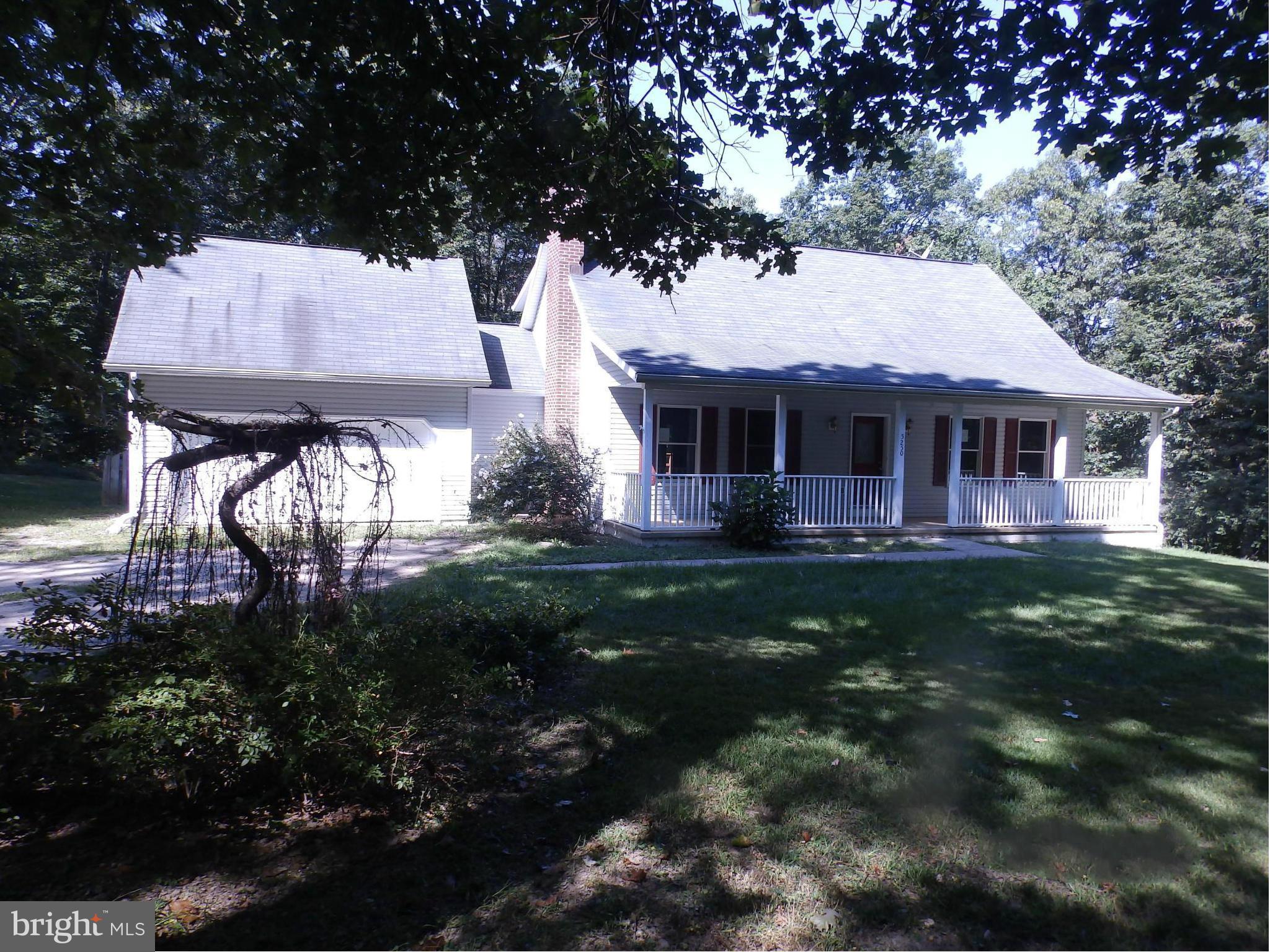 5250 Hoffmanville Road Manchester, MD 21102 - Photo 2 of 29 a front view of a house with garden