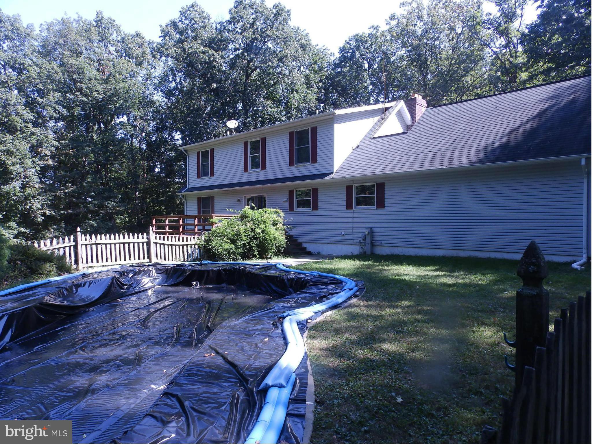 5250 Hoffmanville Road Manchester, MD 21102 - Photo 24 of 29 a backyard of a house with table and chairs