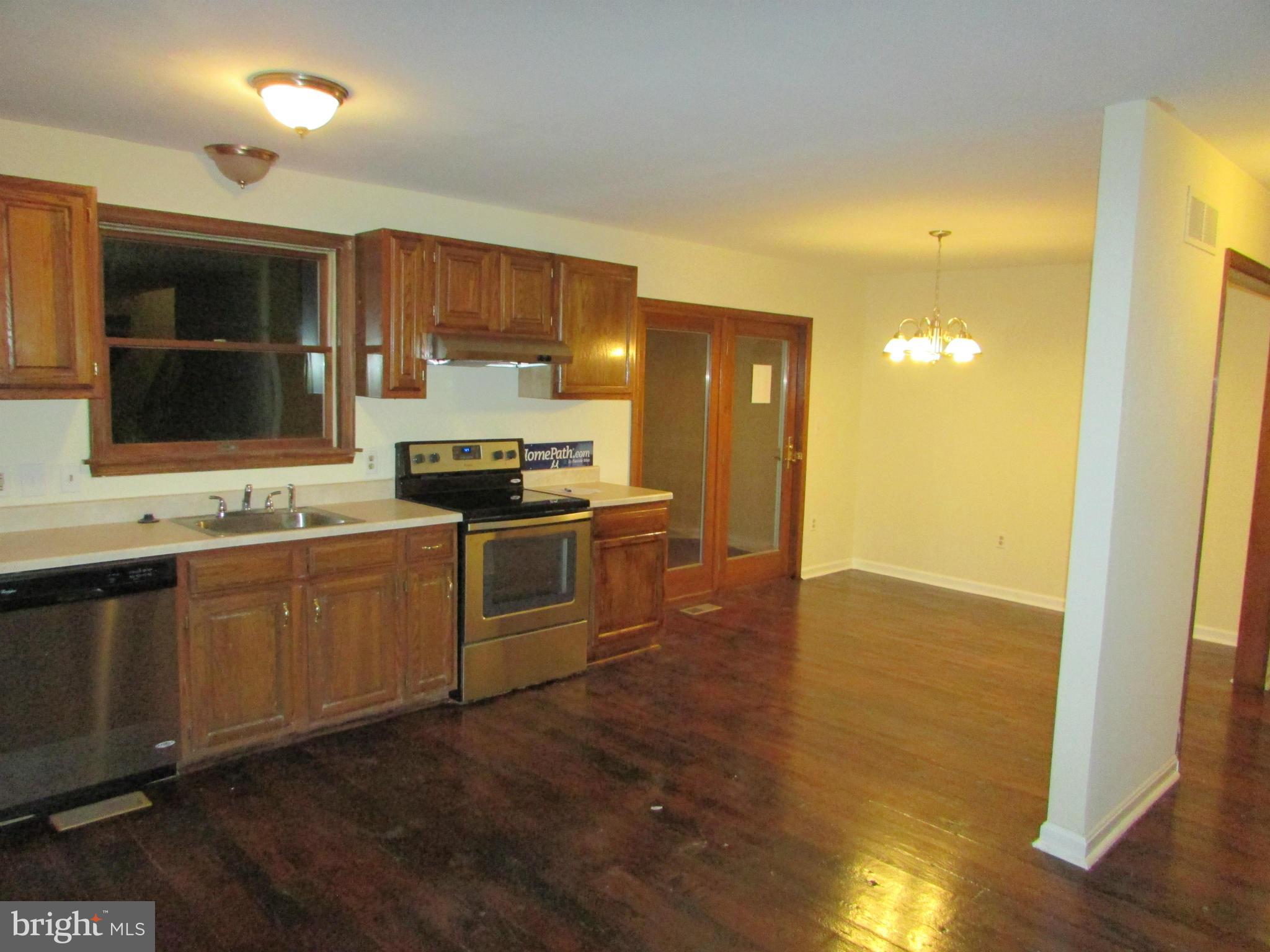 5250 Hoffmanville Road Manchester, MD 21102 - Photo 6 of 29 a kitchen with granite countertop a sink and cabinets