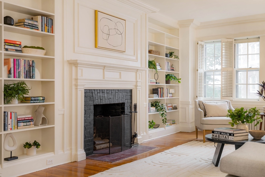 984 Memorial Drive, Unit 984503 Cambridge, MA 02138 - Photo 4 of 30 a living room with furniture and a fireplace