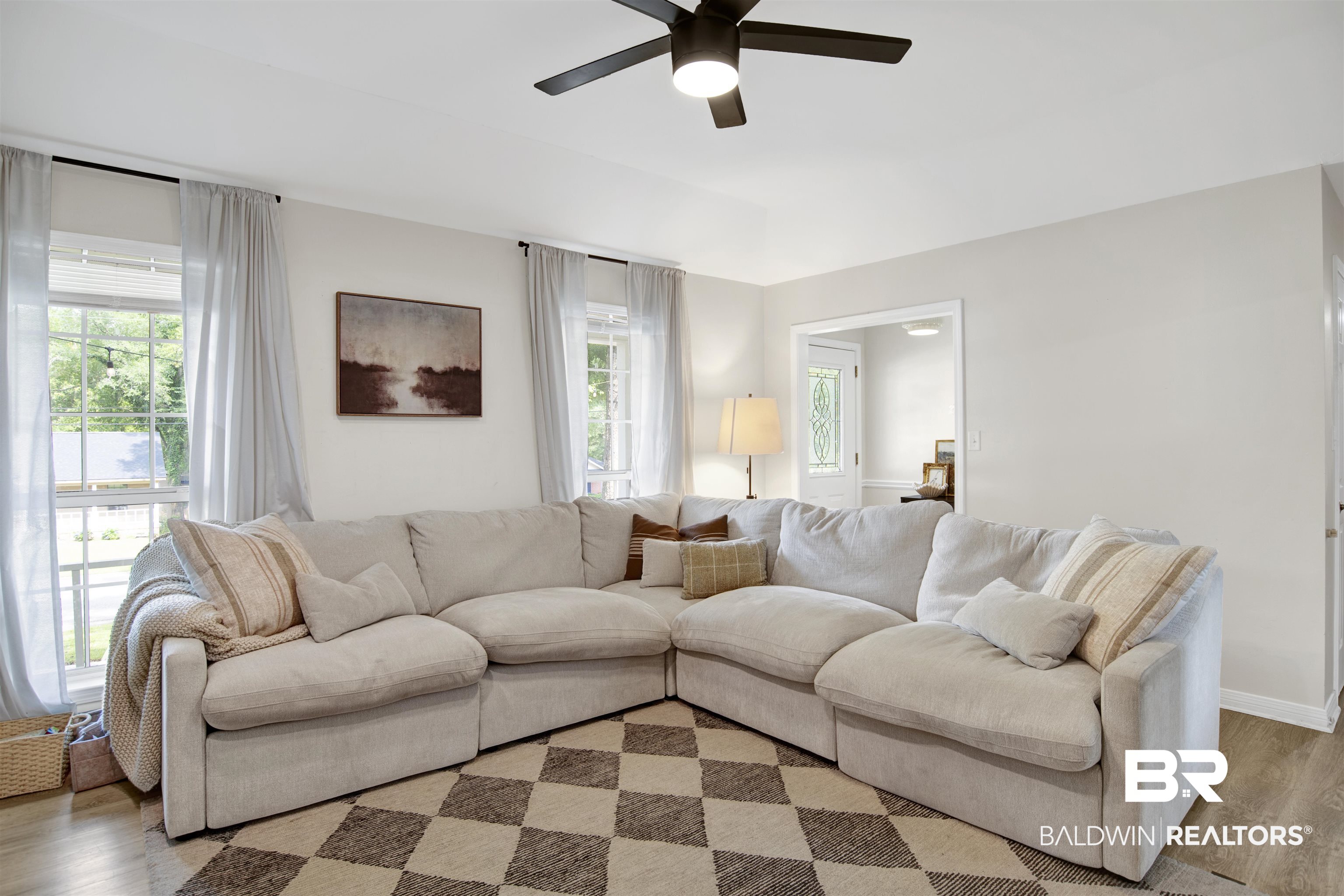 142 Richmond Road Daphne, AL 36526 - Photo 9 of 27 Living area featuring ceiling fan and wood finished floors