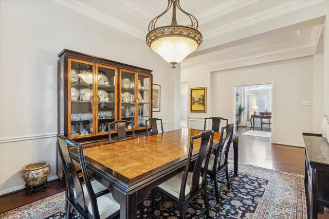 a dining room with a table and chairs