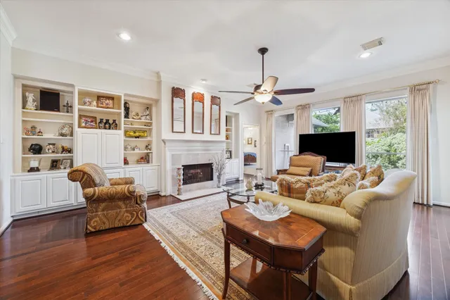 a living room with furniture fireplace and a flat screen tv