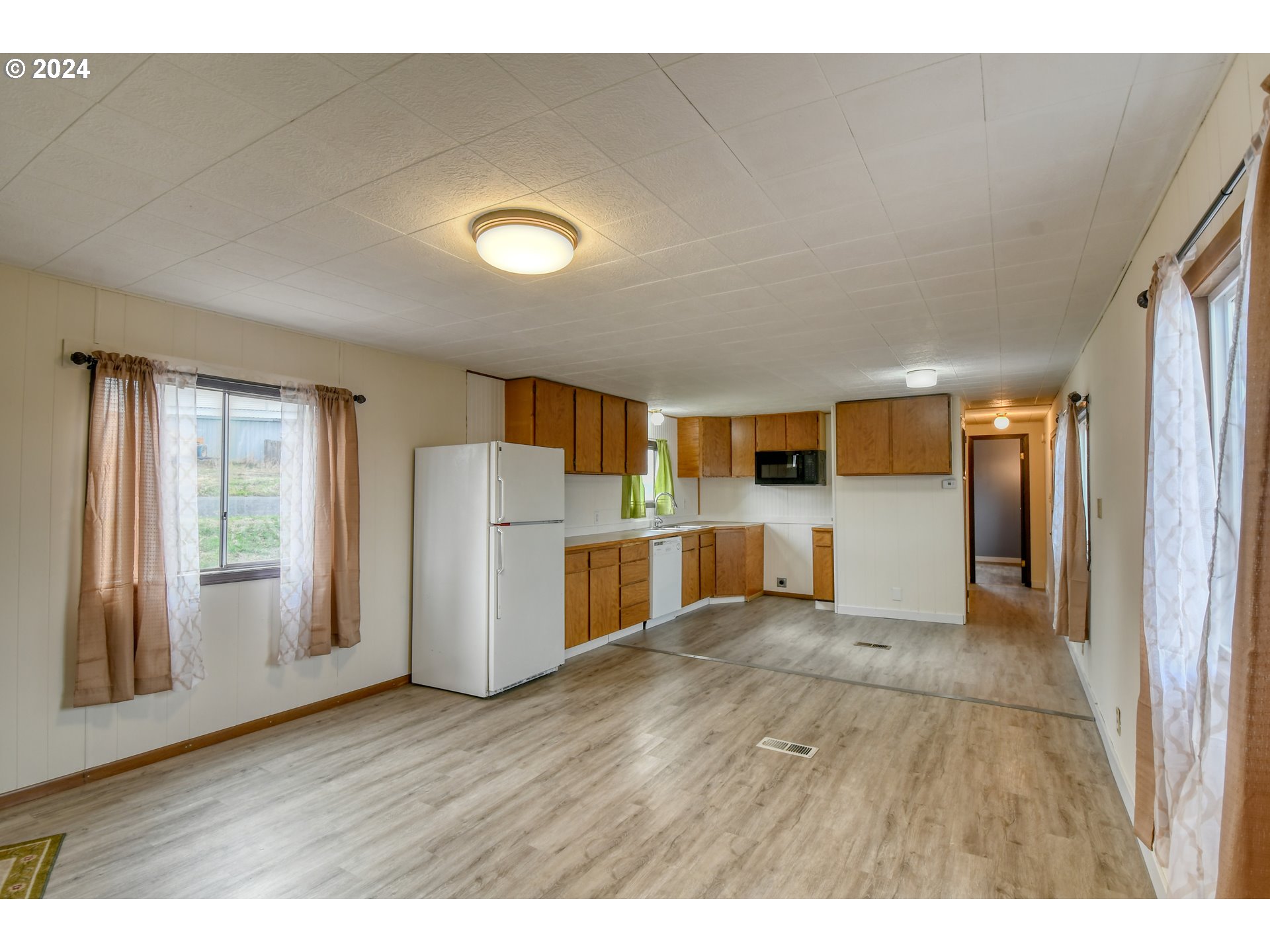 1801 Southwest Goodwin Avenue Pendleton, OR 97801 - Photo 9 of 46 a view of a kitchen with furniture and wooden floor