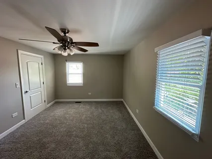 a view of a big room with carpet