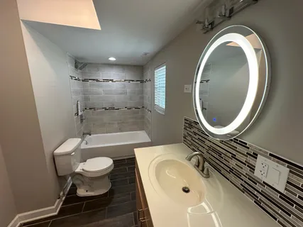 a view of a bathroom with a sink and a bathtub