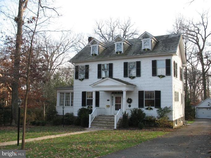 5103 Woodside Road Baltimore, MD 21229 - Photo 1 of 30 a front view of a house with a yard