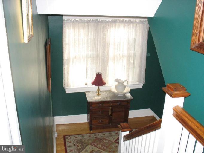 5103 Woodside Road Baltimore, MD 21229 - Photo 11 of 30 a dining room with furniture and a window