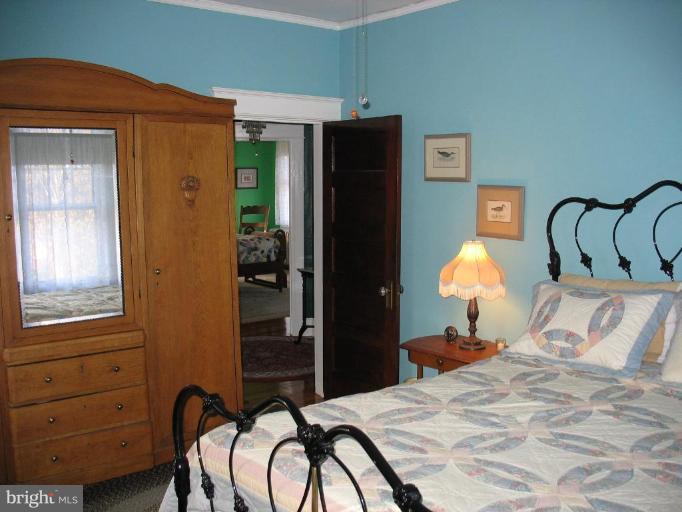 5103 Woodside Road Baltimore, MD 21229 - Photo 17 of 30 a bed room with a bed and a closet