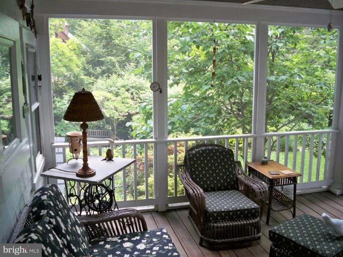 5103 Woodside Road Baltimore, MD 21229 - Photo 23 of 30 a balcony view with a couch and a potted plant