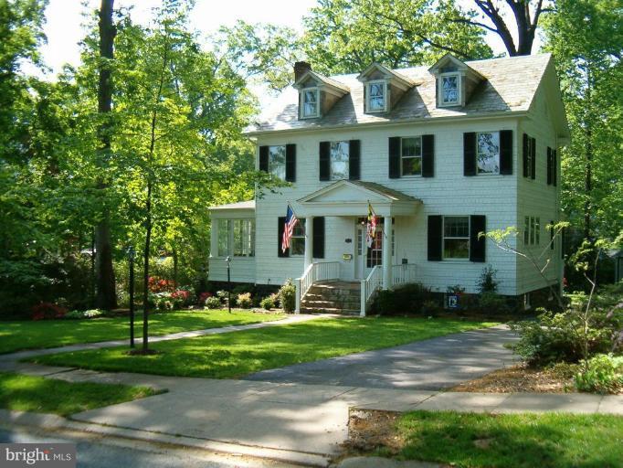 5103 Woodside Road Baltimore, MD 21229 - Photo 25 of 30 a front view of a house with a yard