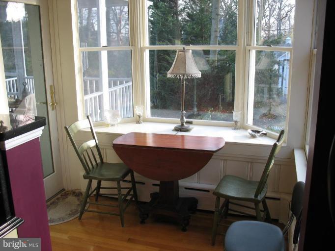 5103 Woodside Road Baltimore, MD 21229 - Photo 10 of 30 a view of a dining room with furniture window and outside view