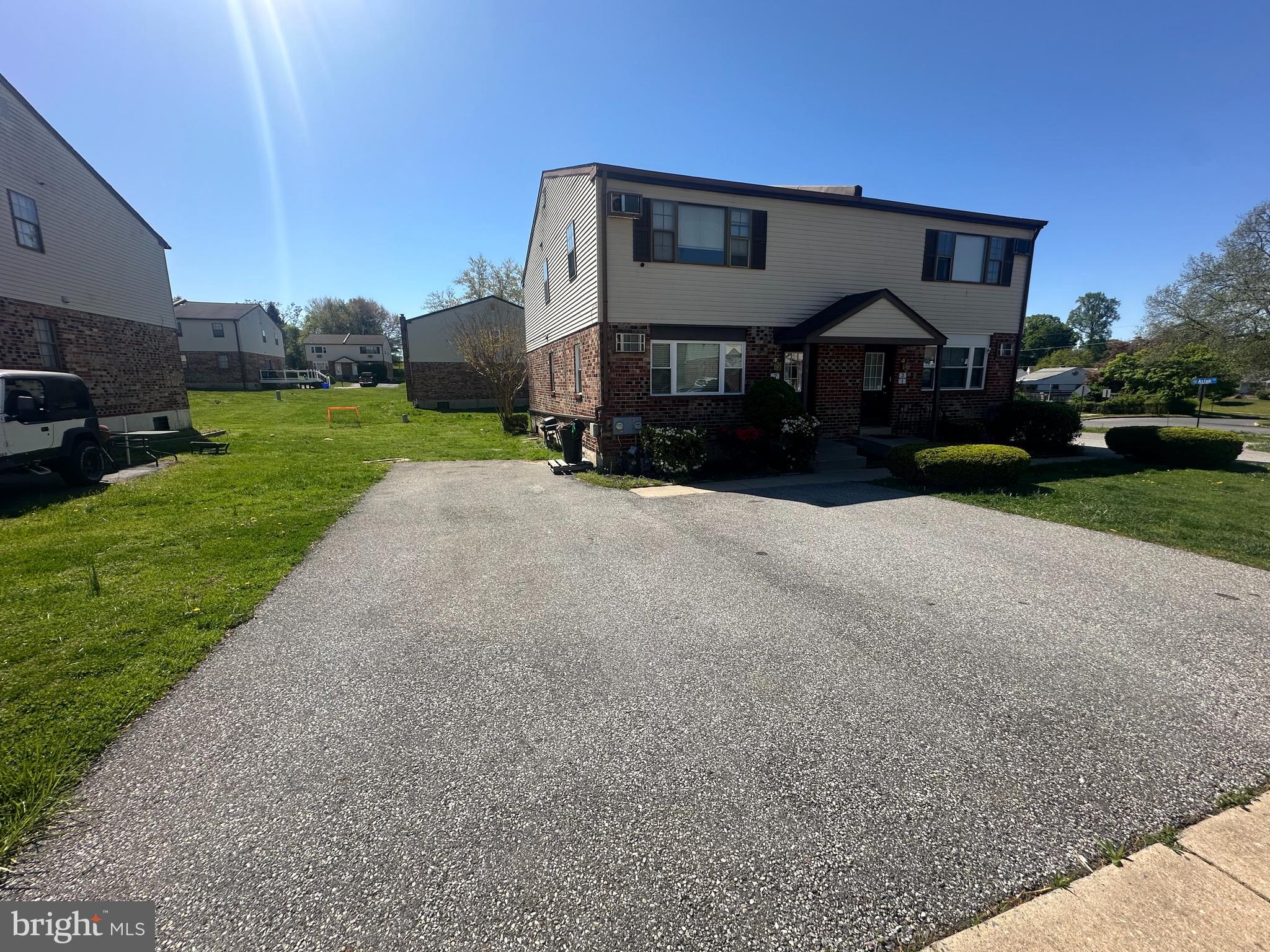 5-7 Thomas Road, Unit 5 Aston, PA 19014 - Photo 13 of 13 a front view of a house with a yard