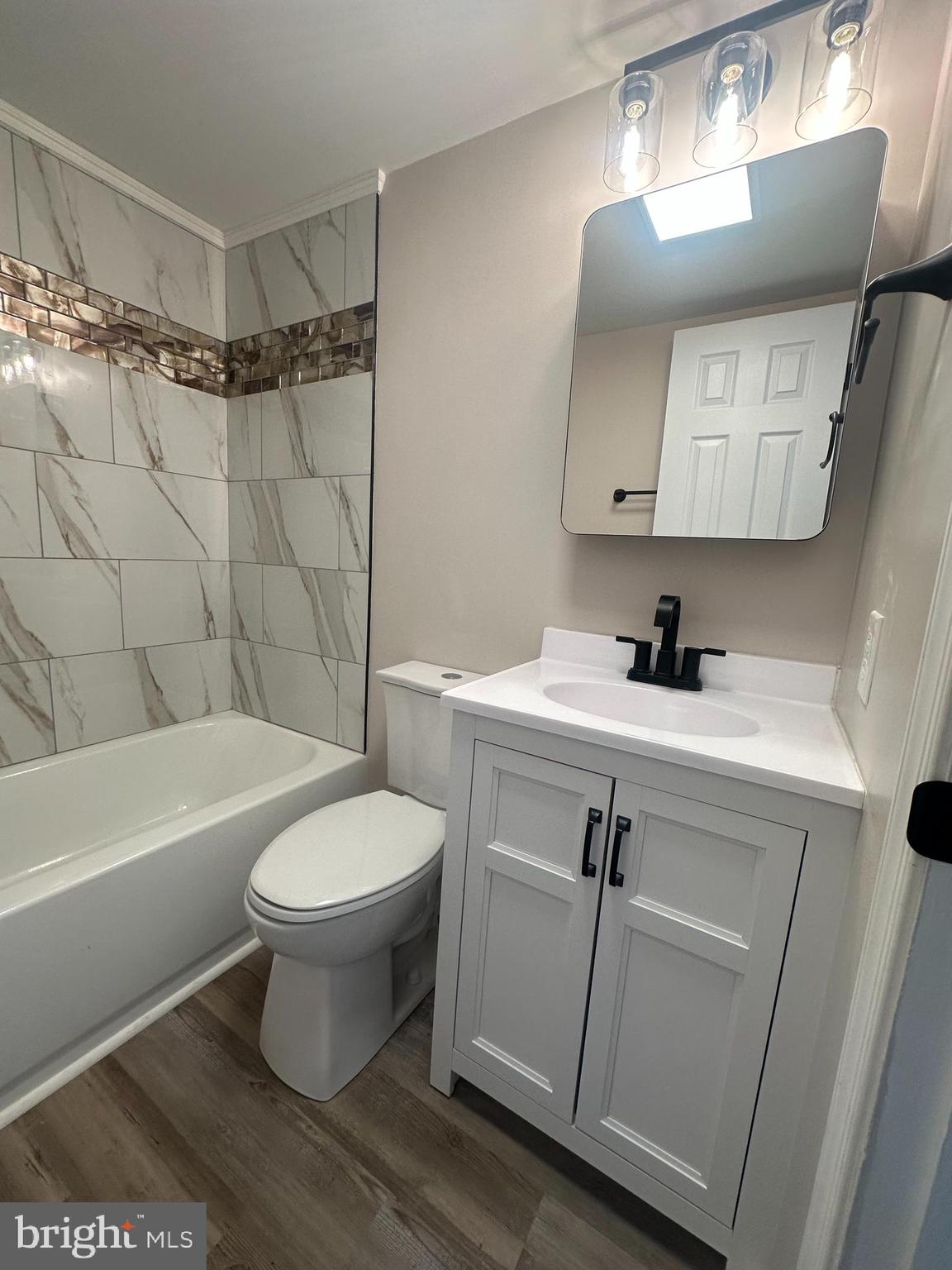 5-7 Thomas Road, Unit 5 Aston, PA 19014 - Photo 7 of 13 a bathroom with a sink toilet and shower