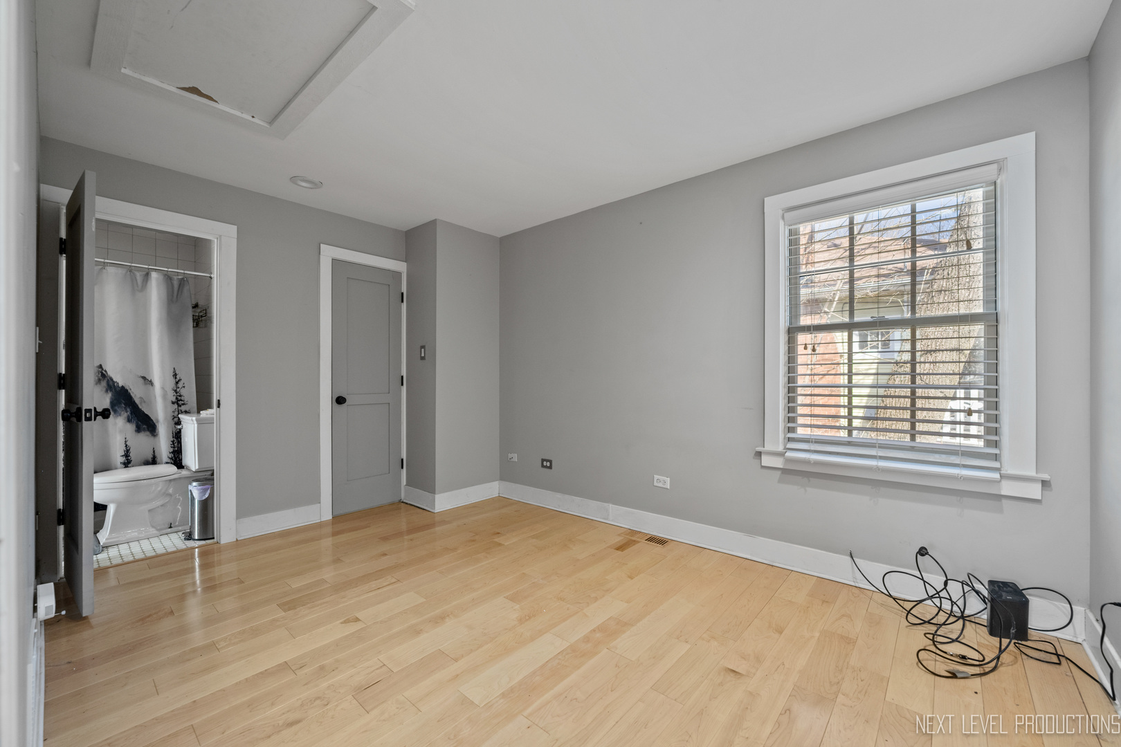 3S520 Batavia Road Warrenville, IL 60555 - Photo 12 of 18 a bedroom with a bed and a window