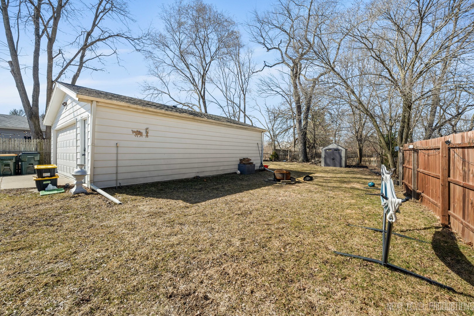 3S520 Batavia Road Warrenville, IL 60555 - Photo 5 of 18 a view of a backyard with a large tree