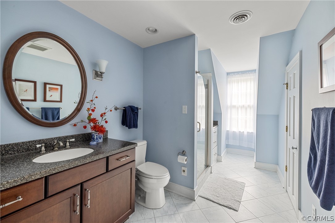 3022 River Hills Lane Midlothian, VA 23113 - Photo 29 of 45 a bathroom with a toilet a sink and a mirror