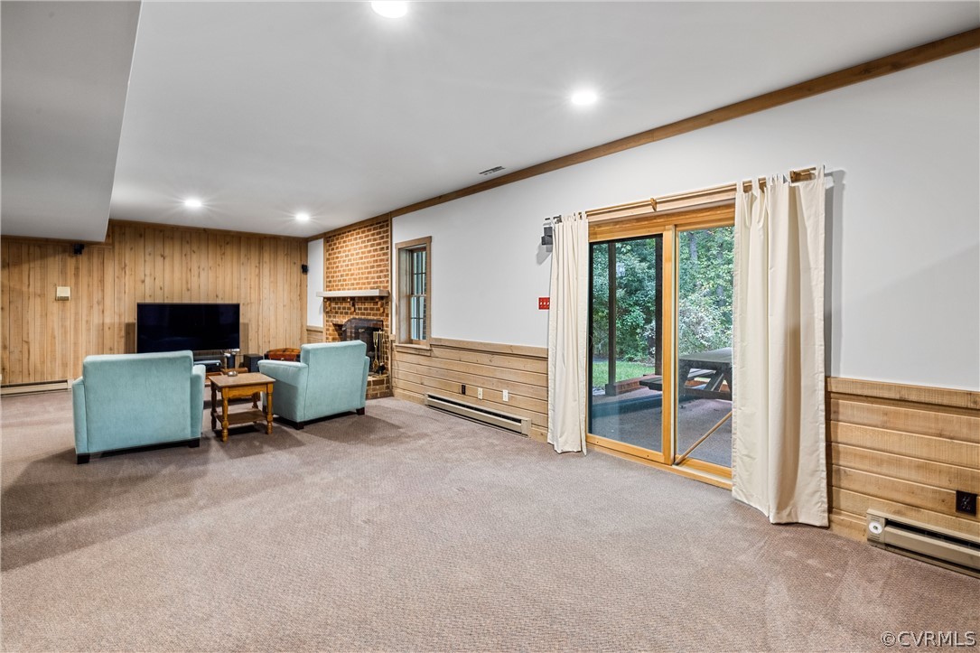 3022 River Hills Lane Midlothian, VA 23113 - Photo 36 of 45 a living room with furniture a flat screen tv and a large window