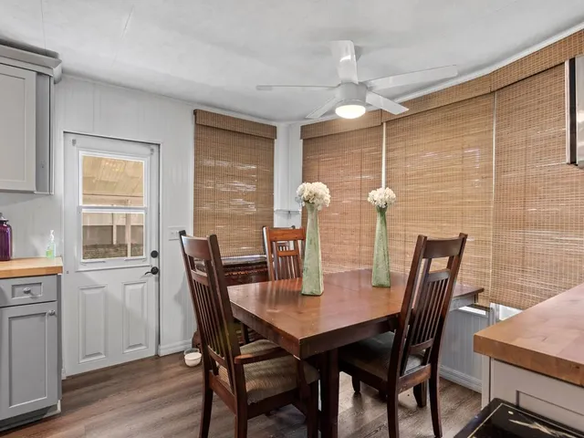 a dining room with furniture and window