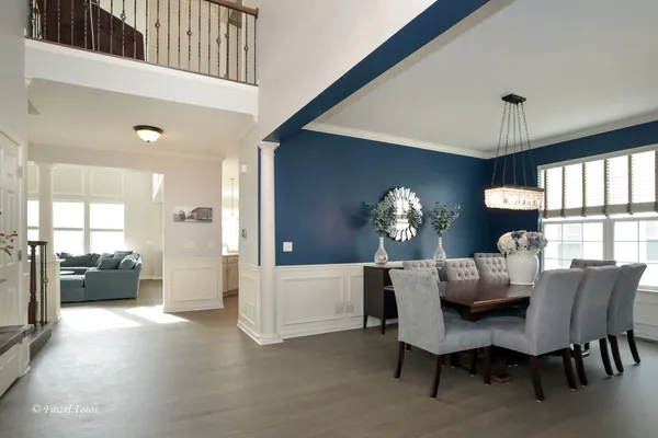 a dining room with furniture and window
