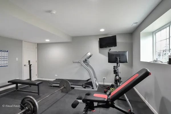 a room with furniture and air hockey table