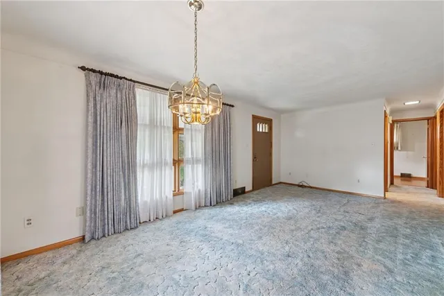 a view of a chandelier and window in a room