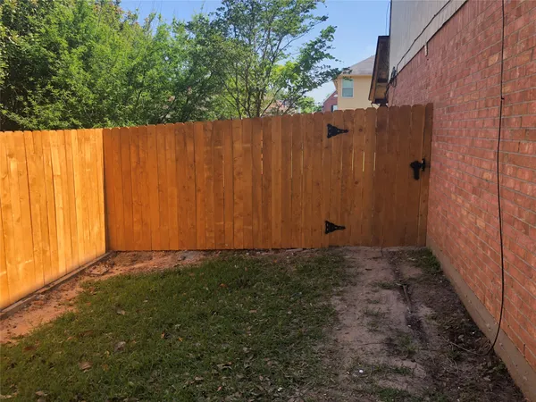 a view of a back yard from a room