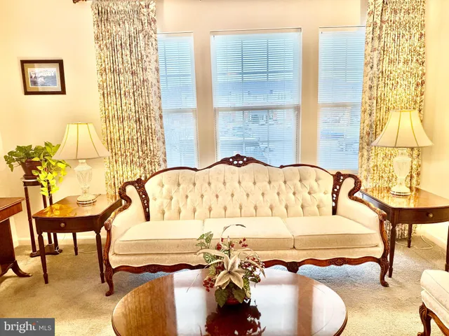 a view of a balcony with table and chairs