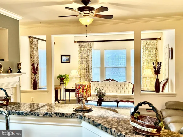 a living room with a couch and a large window