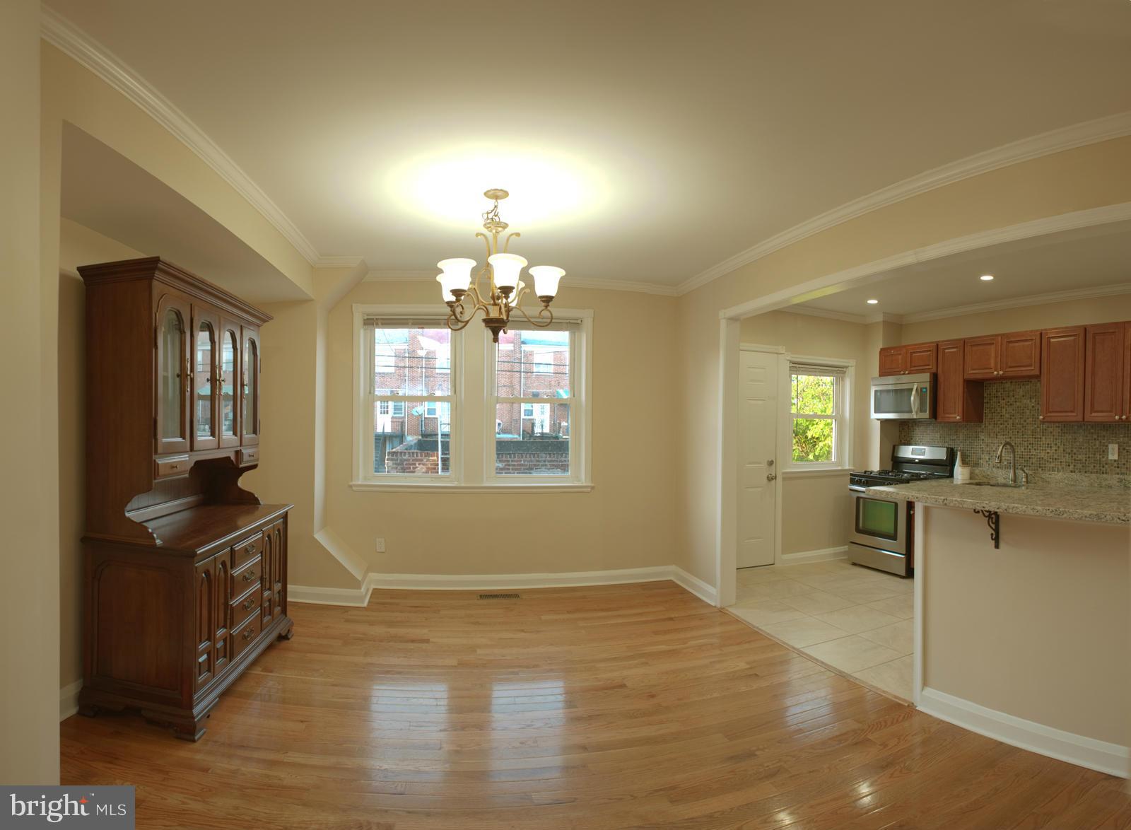 1536 Kingsway Road Baltimore, MD 21218 - Photo 1 of 20 a view of an empty room and window