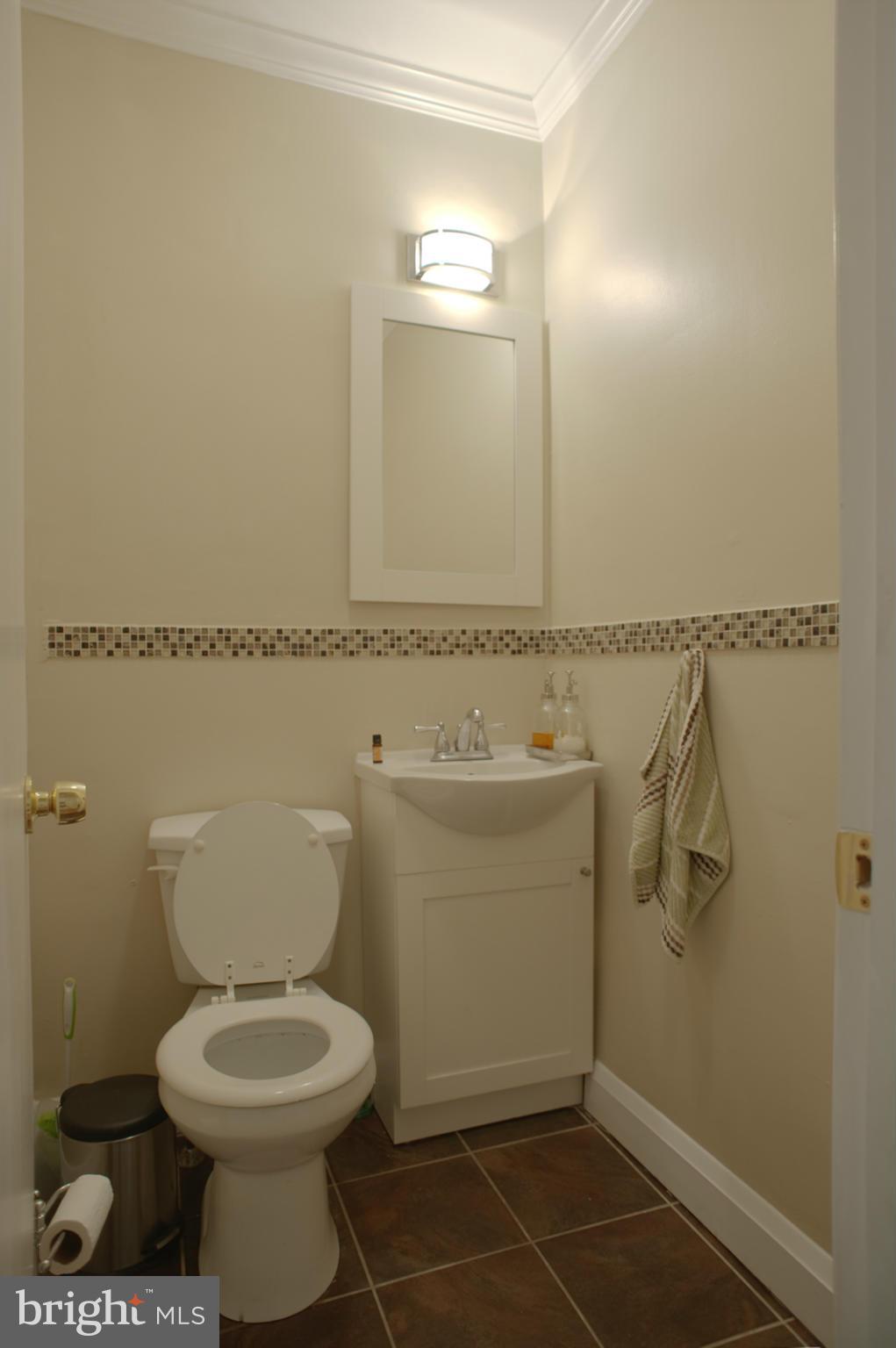 1536 Kingsway Road Baltimore, MD 21218 - Photo 14 of 20 a bathroom with a toilet and a mirror