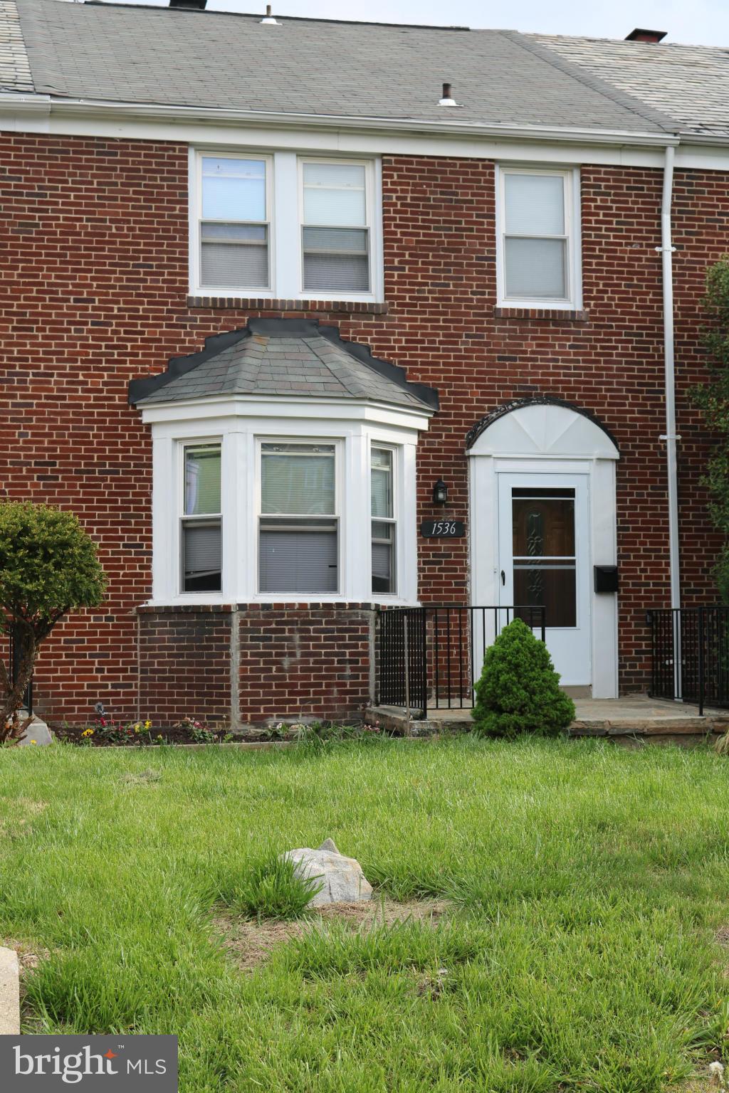 1536 Kingsway Road Baltimore, MD 21218 - Photo 20 of 20 a front view of a house with a yard