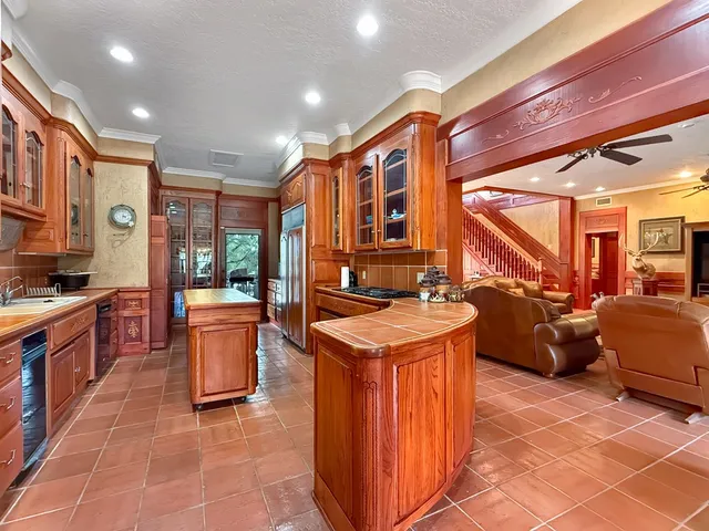 a kitchen that has a sink and a stove in it