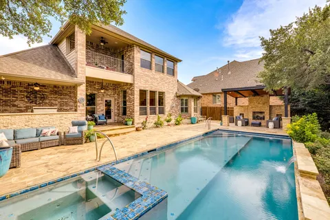 a view of a patio with swimming pool table and chairs