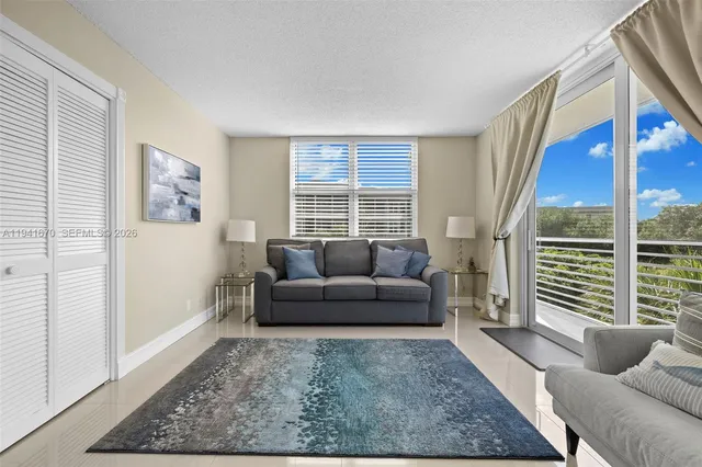 a living room with furniture and a window