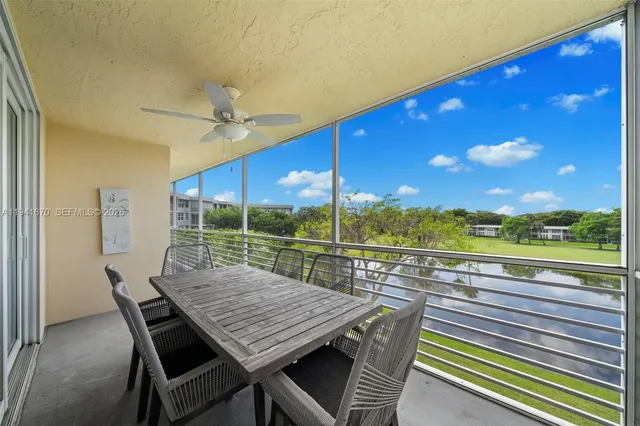 a view of a balcony with a table and chairs