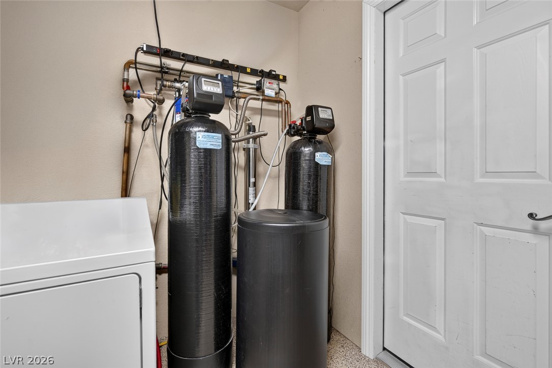 818 Manor Shores Road Henderson, NV 89002 - Photo 28 of 35 A dedicated utility space with essential systems for water treatment and laundry.