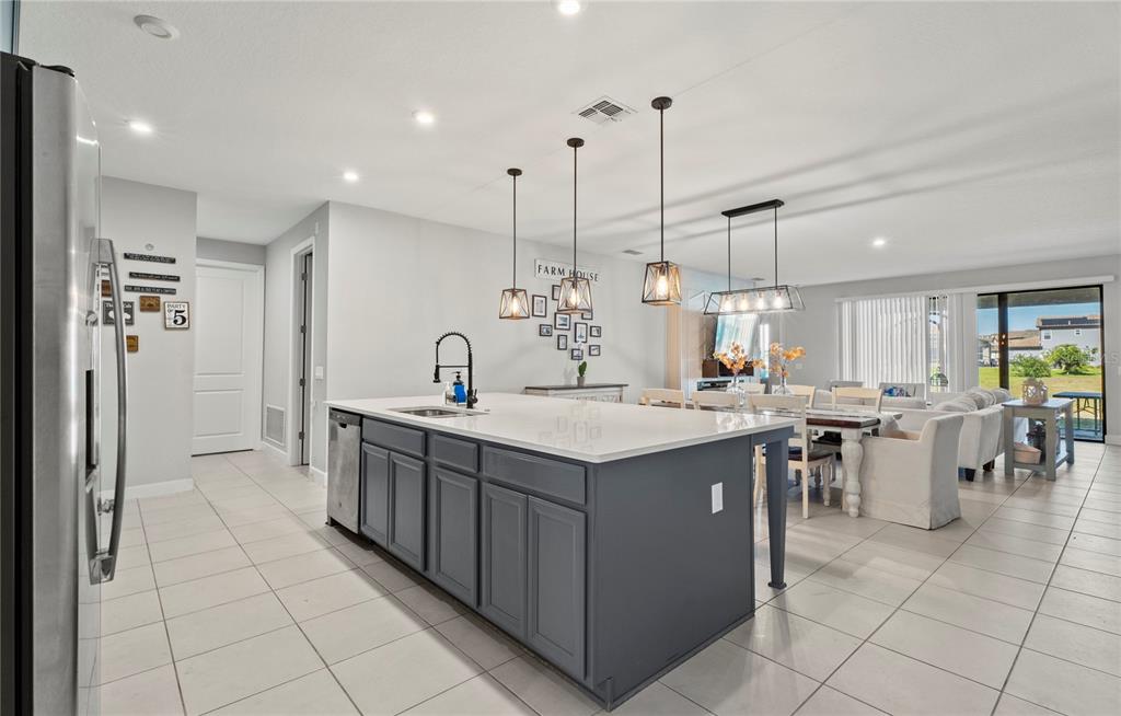 2731 Rialto Court Kissimmee, FL 34746 - Photo 12 of 49 a kitchen with lots of counter top space and appliances