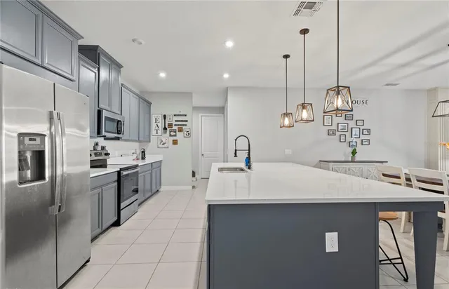 a kitchen with a sink and stove