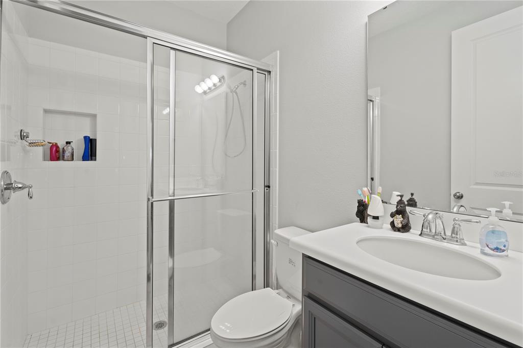 2731 Rialto Court Kissimmee, FL 34746 - Photo 23 of 49 a bathroom with a sink toilet and shower