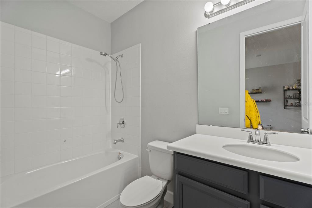 2731 Rialto Court Kissimmee, FL 34746 - Photo 26 of 49 a bathroom with a sink toilet and shower