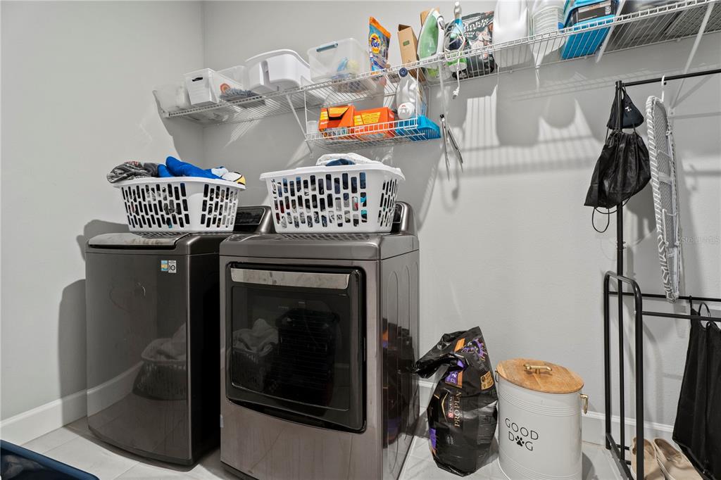 2731 Rialto Court Kissimmee, FL 34746 - Photo 27 of 49 a utility room with dryer and washer