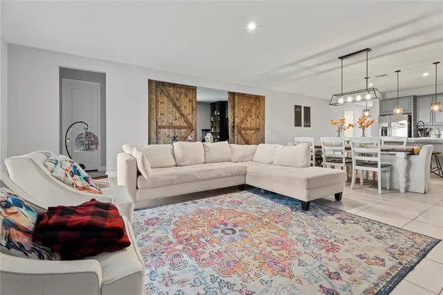 a spacious bedroom with a bed and a large window