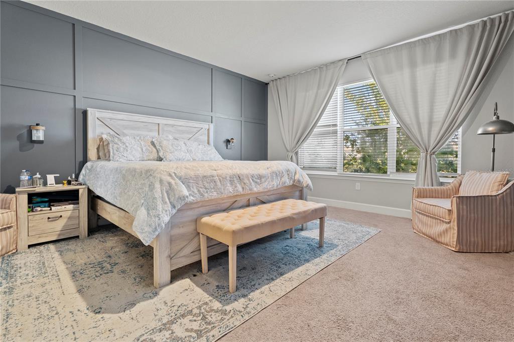 2731 Rialto Court Kissimmee, FL 34746 - Photo 30 of 49 a spacious bedroom with a bed and a large window