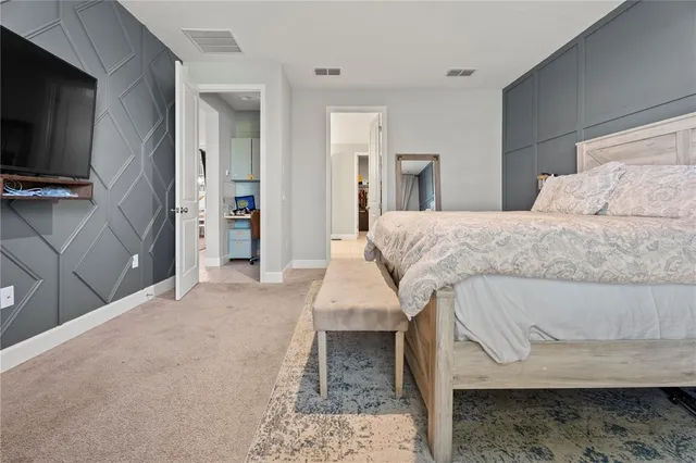 a spacious bathroom with a double vanity sink a mirror and a bathtub