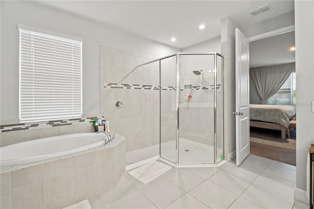 2731 Rialto Court Kissimmee, FL 34746 - Photo 34 of 49 a bathroom with a tub and a shower