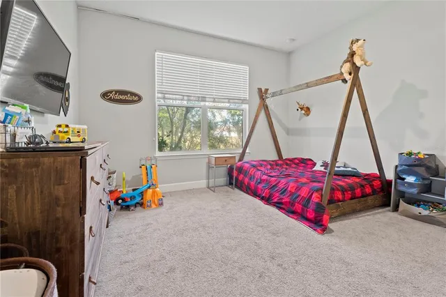 a bed room with a bed and a couch