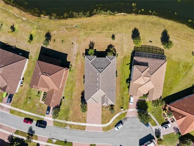 an aerial view of residential houses with outdoor space